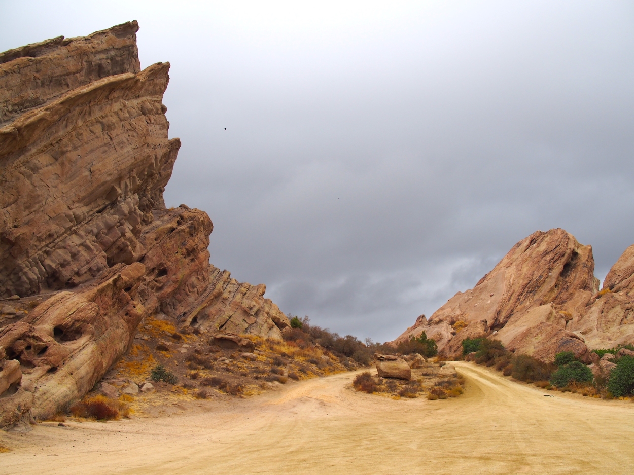 rocks jutting out of the sandy earth at Vasquez Rocks in the southern California desert